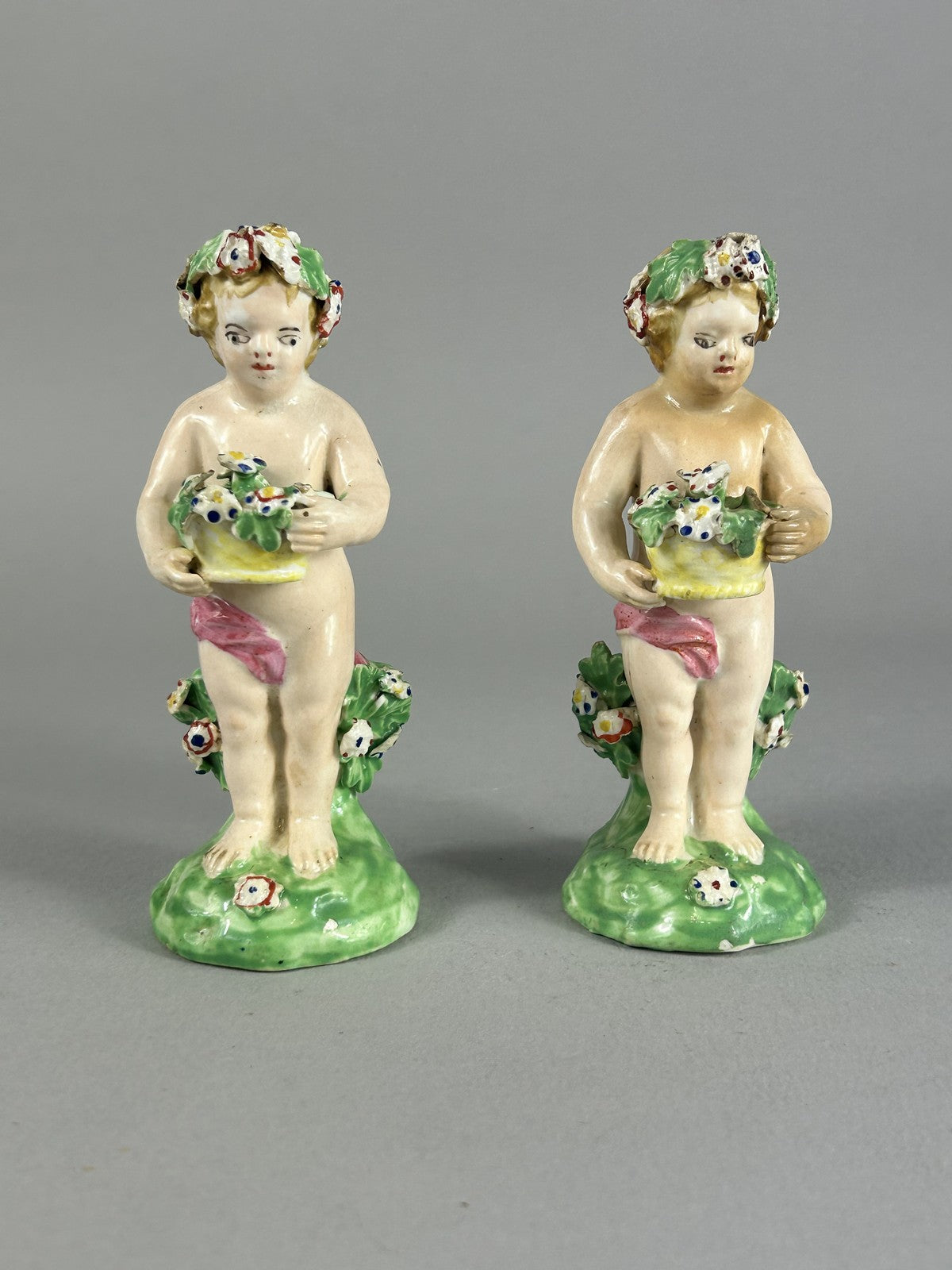 Antique Derby porcelain putti figures with flower baskets c.1780