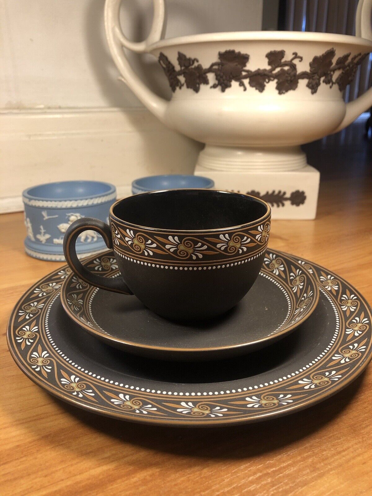 Wedgwood painted trio basalt cup and saucers