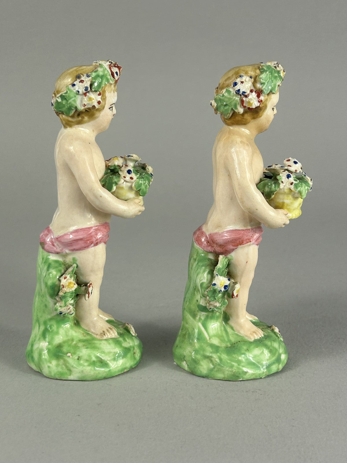 Antique Derby porcelain putti figures with flower baskets c.1780