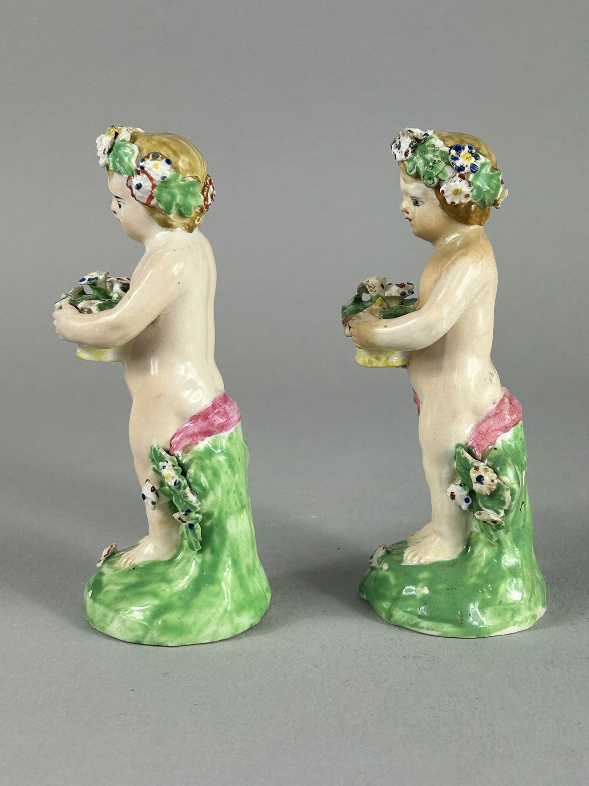 Antique Derby porcelain putti figures with flower baskets c.1780