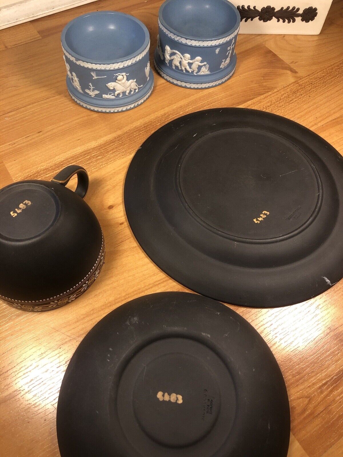 Wedgwood painted trio basalt cup and saucers