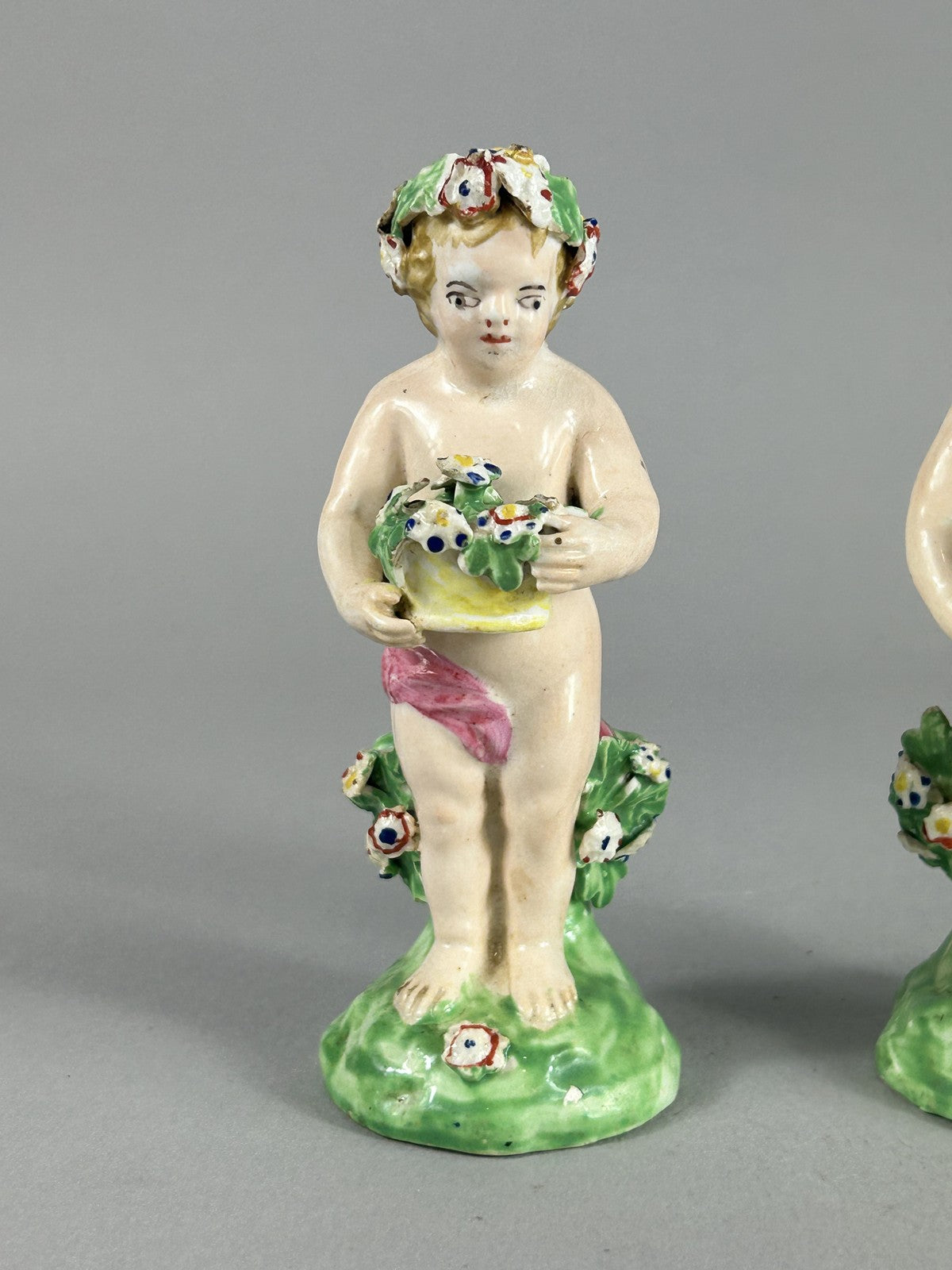 Antique Derby porcelain putti figures with flower baskets c.1780