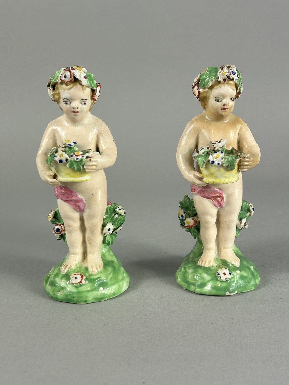 Antique Derby porcelain putti figures with flower baskets c.1780