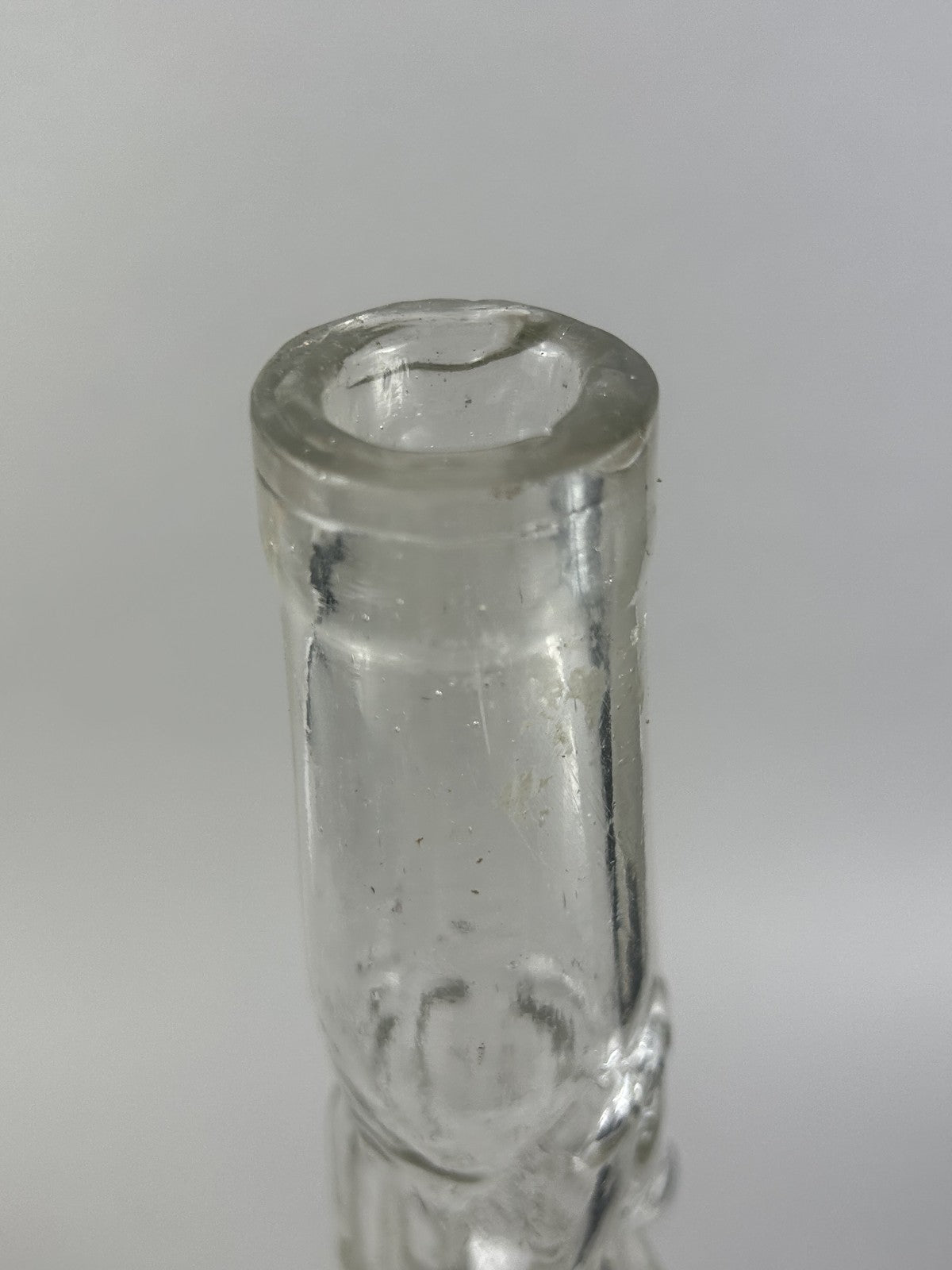 Antique clear glass snake and dolphin liquor bottle, 37cm crafts display