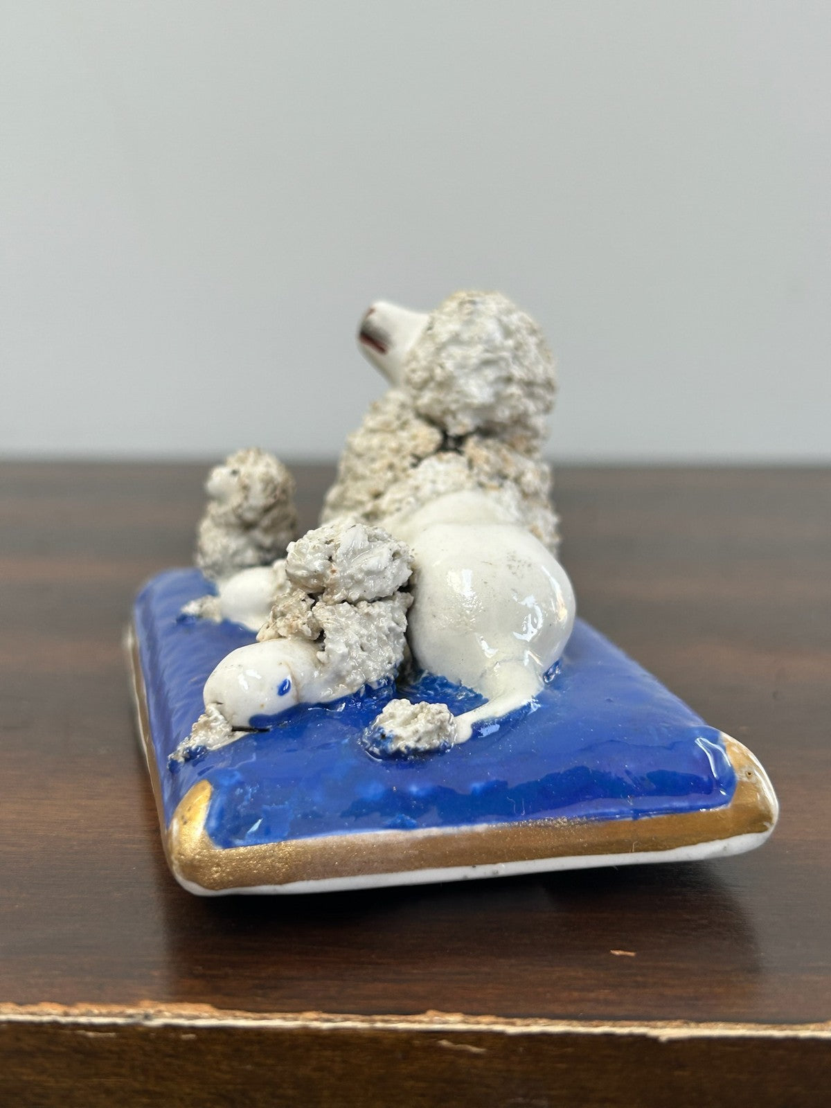 Antique Staffordshire Porcelain Poodle on Cobalt Cushion Crumb Texture3