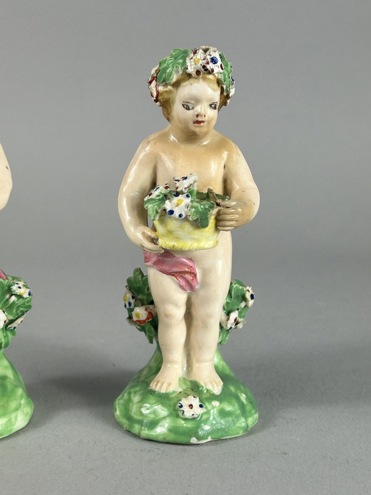 Antique Derby porcelain putti figures with flower baskets c.1780