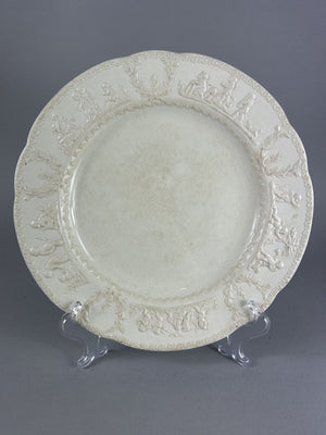 Early Wedgwood creamware plate with moulded putti border, 26cm