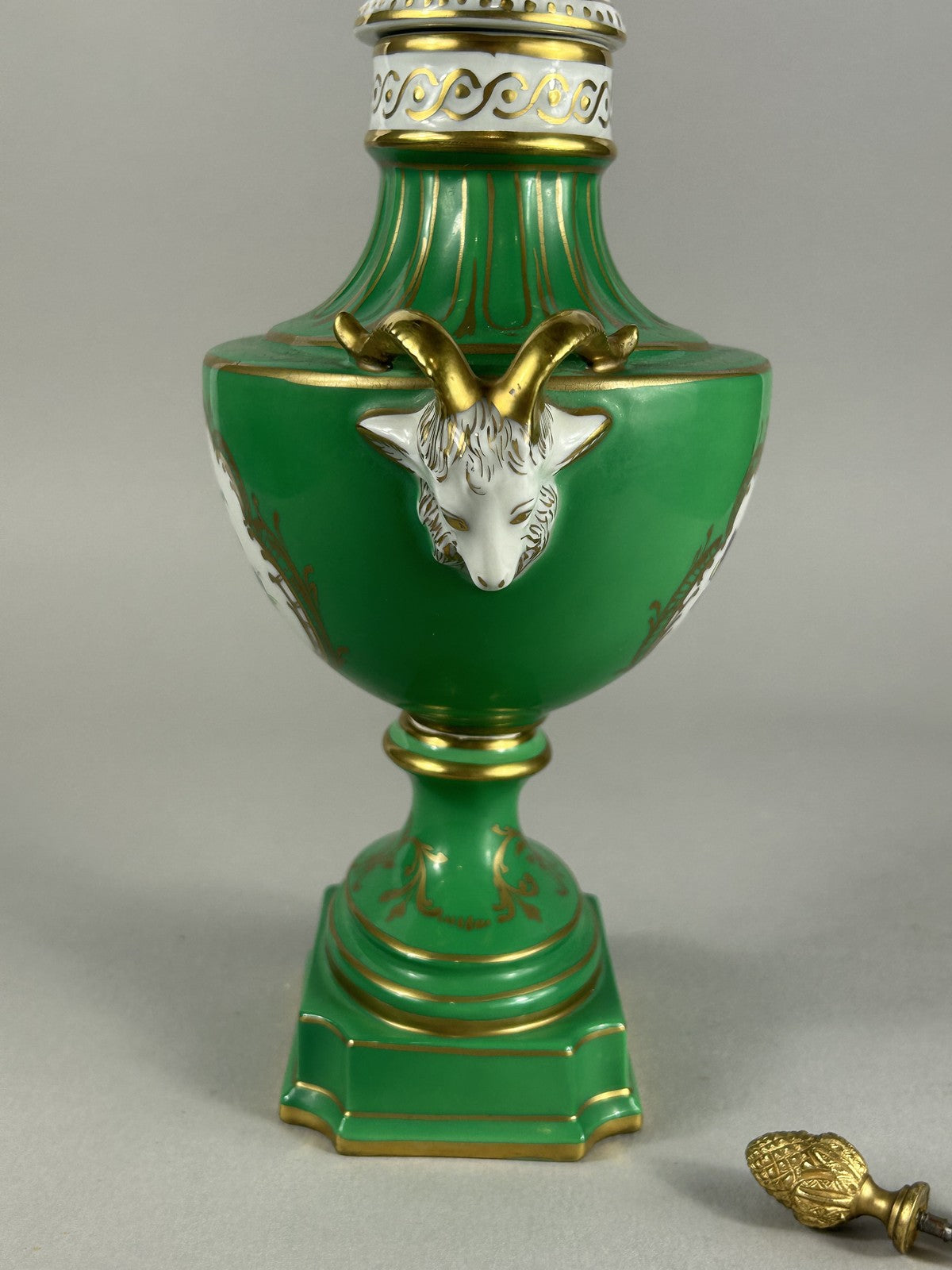 Dresden green porcelain ram’s head lamp base vase with finial