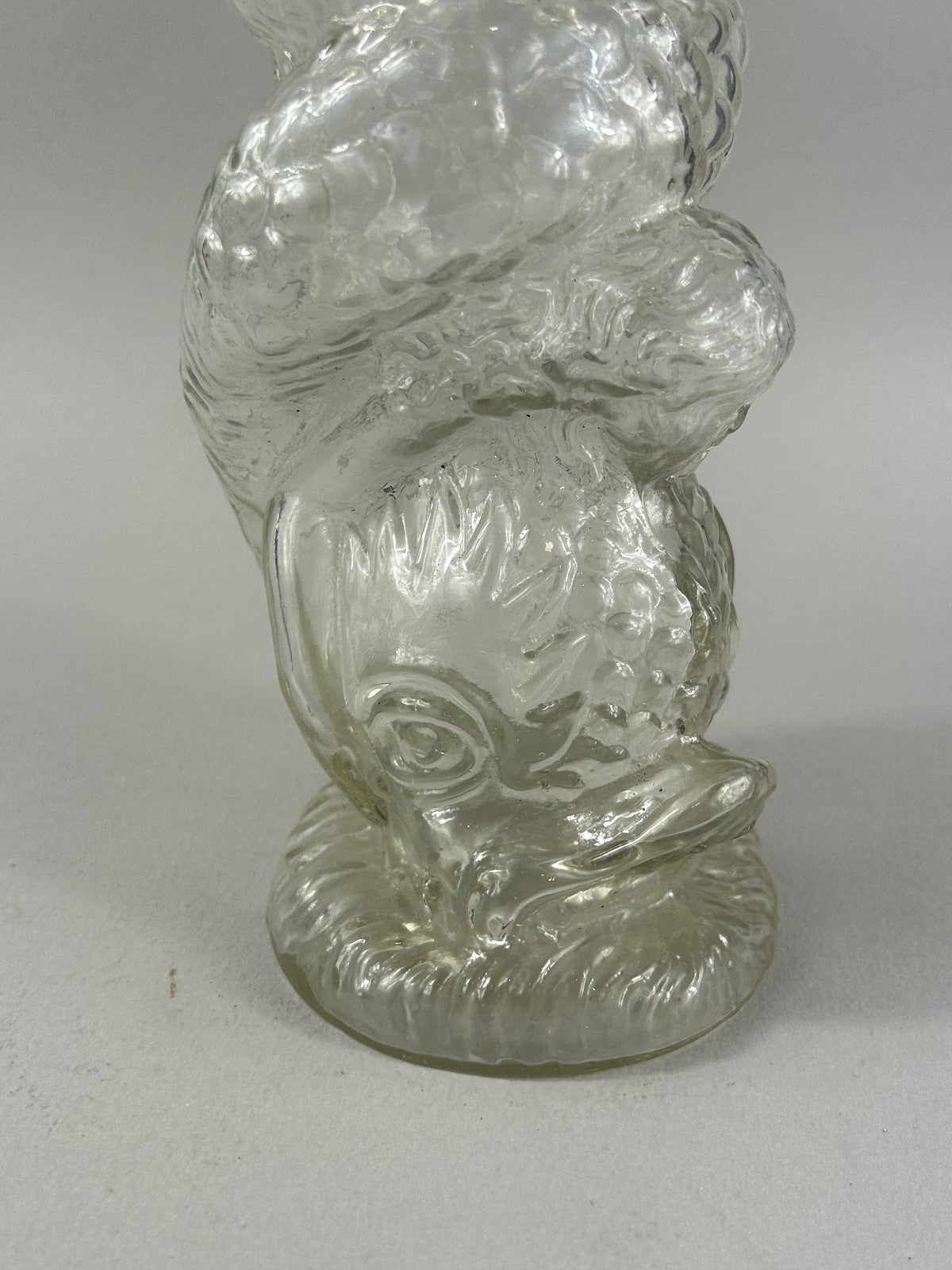 Antique clear glass snake and dolphin liquor bottle, 37cm crafts display