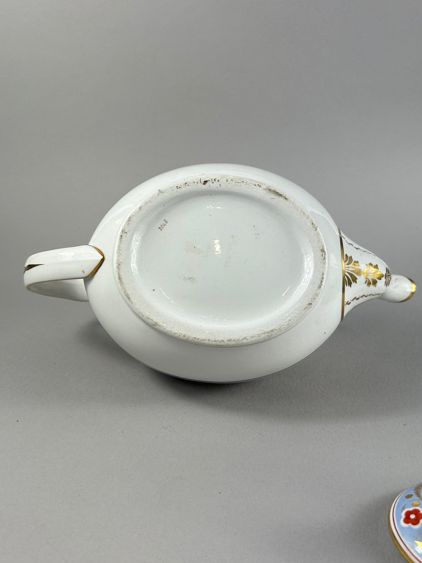 Early 19th Century British Porcelain Teapot with Gilt Floral Border