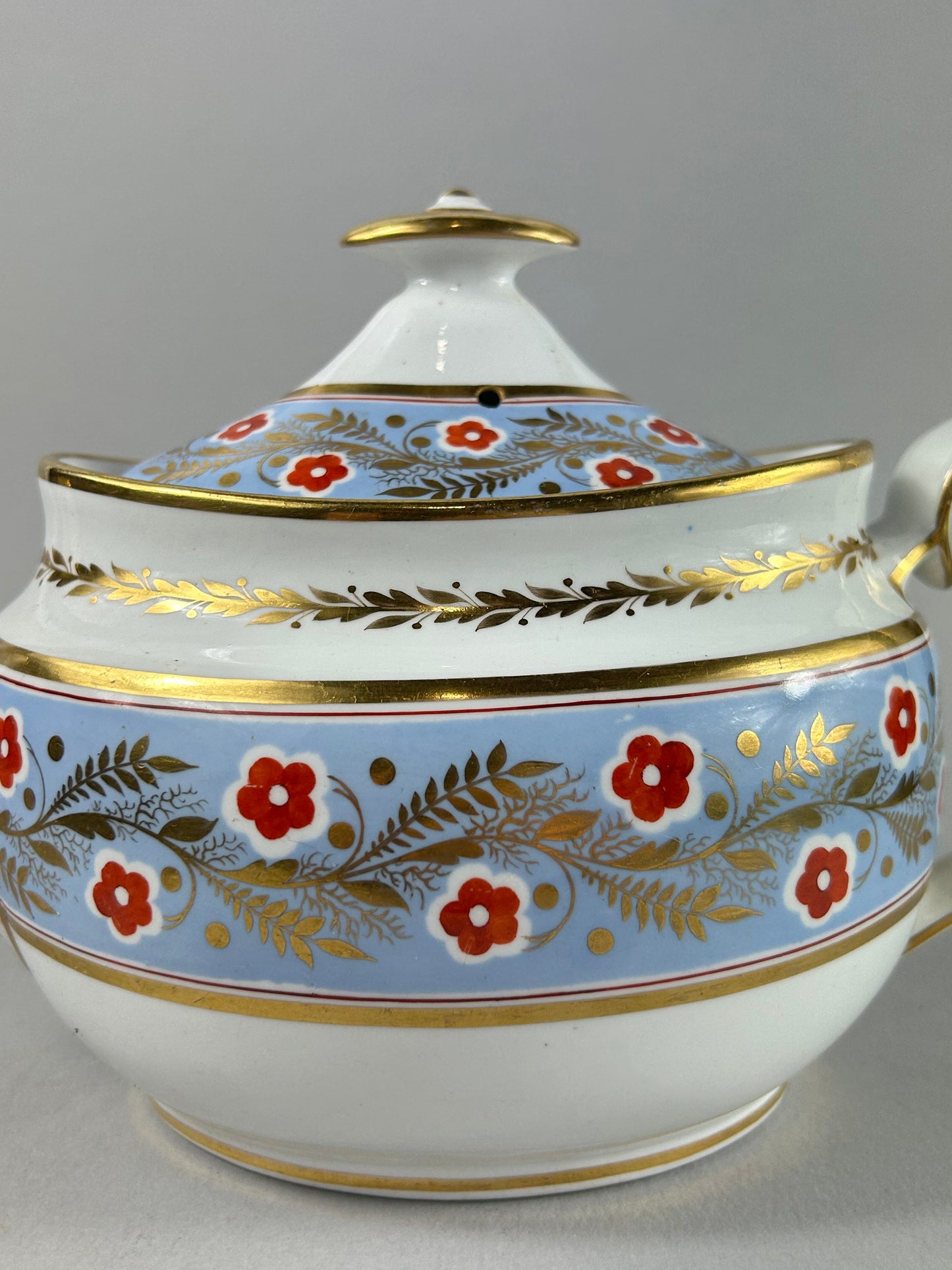 Early 19th Century British Porcelain Teapot with Gilt Floral Border
